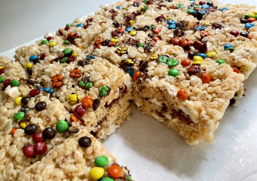 the inside of these m&m rice krispie treats are thick, and filled with marshmallows and chocolate.
