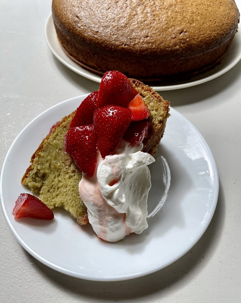 Olive oil basil cake with strawberries and whipped cream.