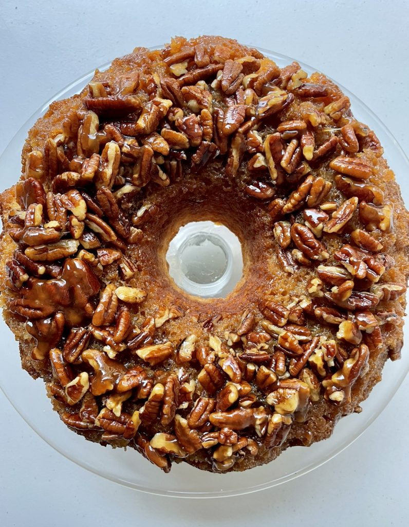 Upside down pecan cake after being inverted from the bundt pan.