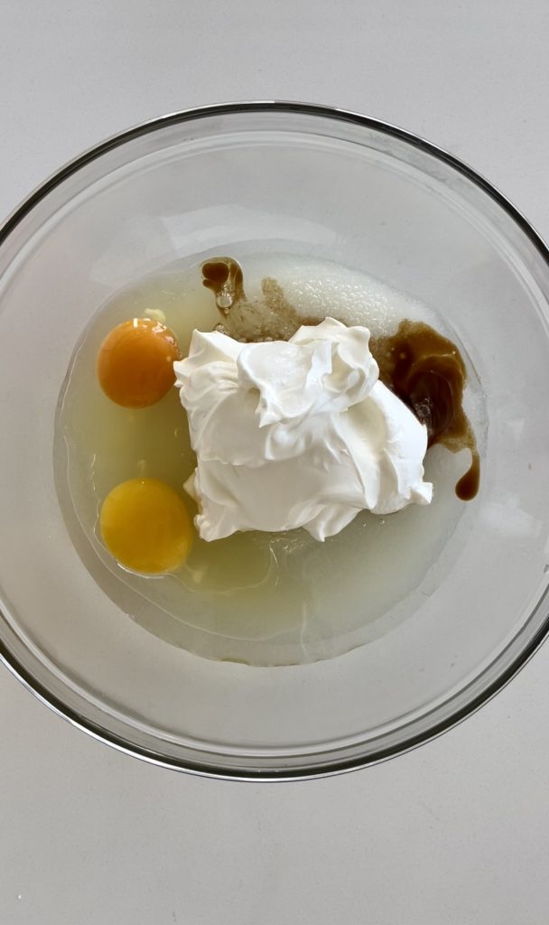For the wet ingredients, you'll need sugar, oil, eggs, sour cream and vanilla extract. 