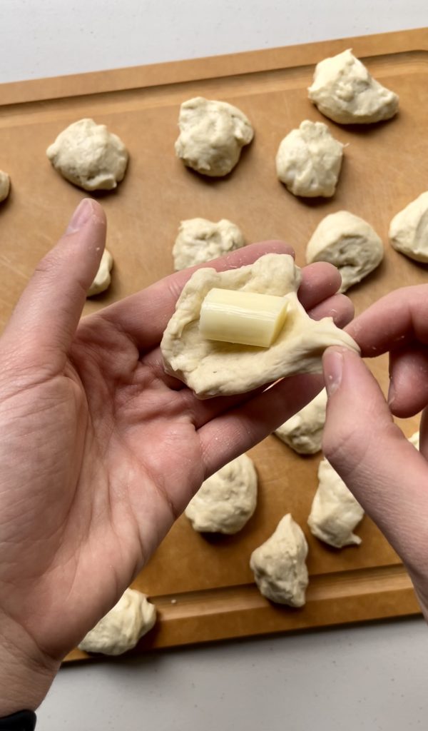 Make sure to completely wrap the dough around the cheese so that it doesn't ooze out while baking.