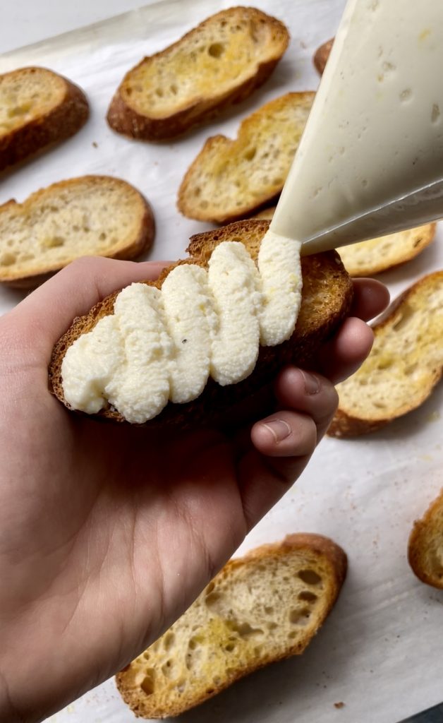 Piping the ricotta mixture onto the toasted bread gives this appetizer a fancier look.
