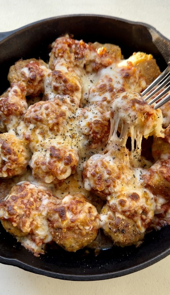 Broiling the cheese on top of these meatballs is one of my favorite parts of this dish!