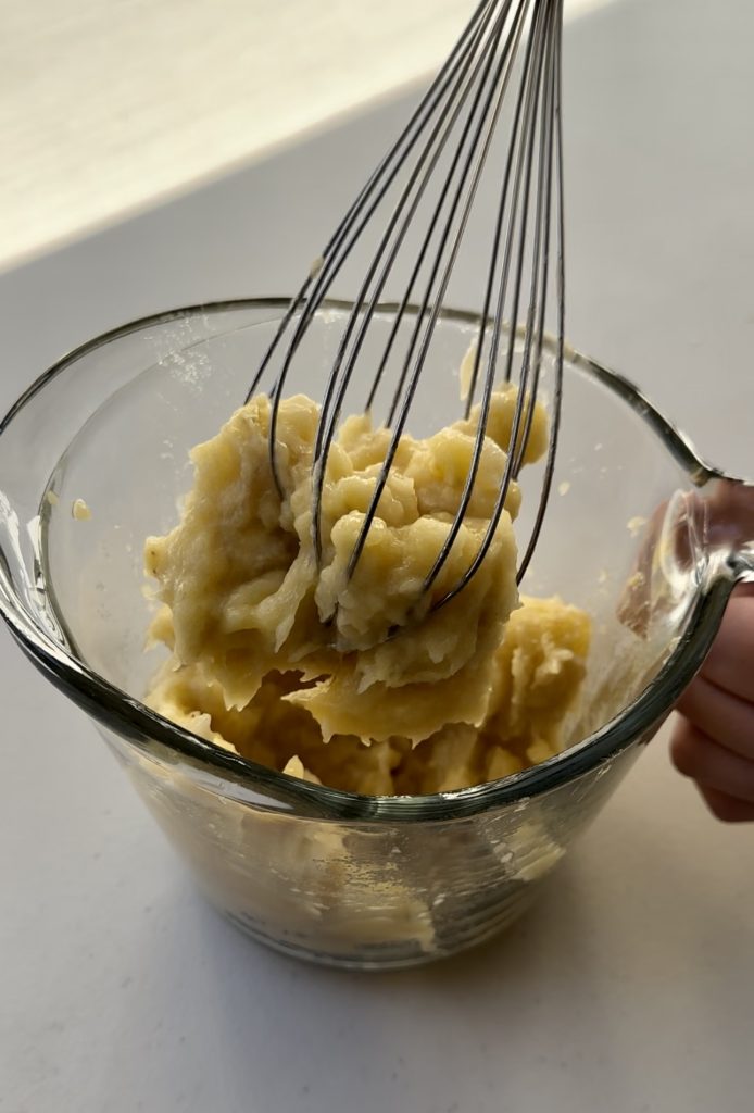 It's important to mash your bananas before adding them to the cake batter  so that it's not too lumpy.