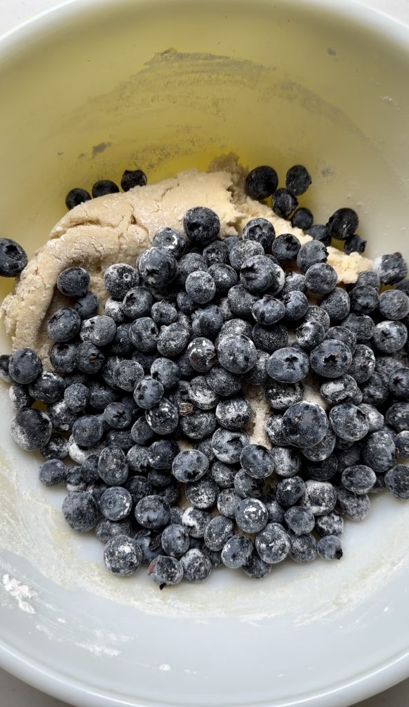 Tossing the blueberries in flour before adding them to the batter prevents them from sinking to the bottom of the cake while it bakes.