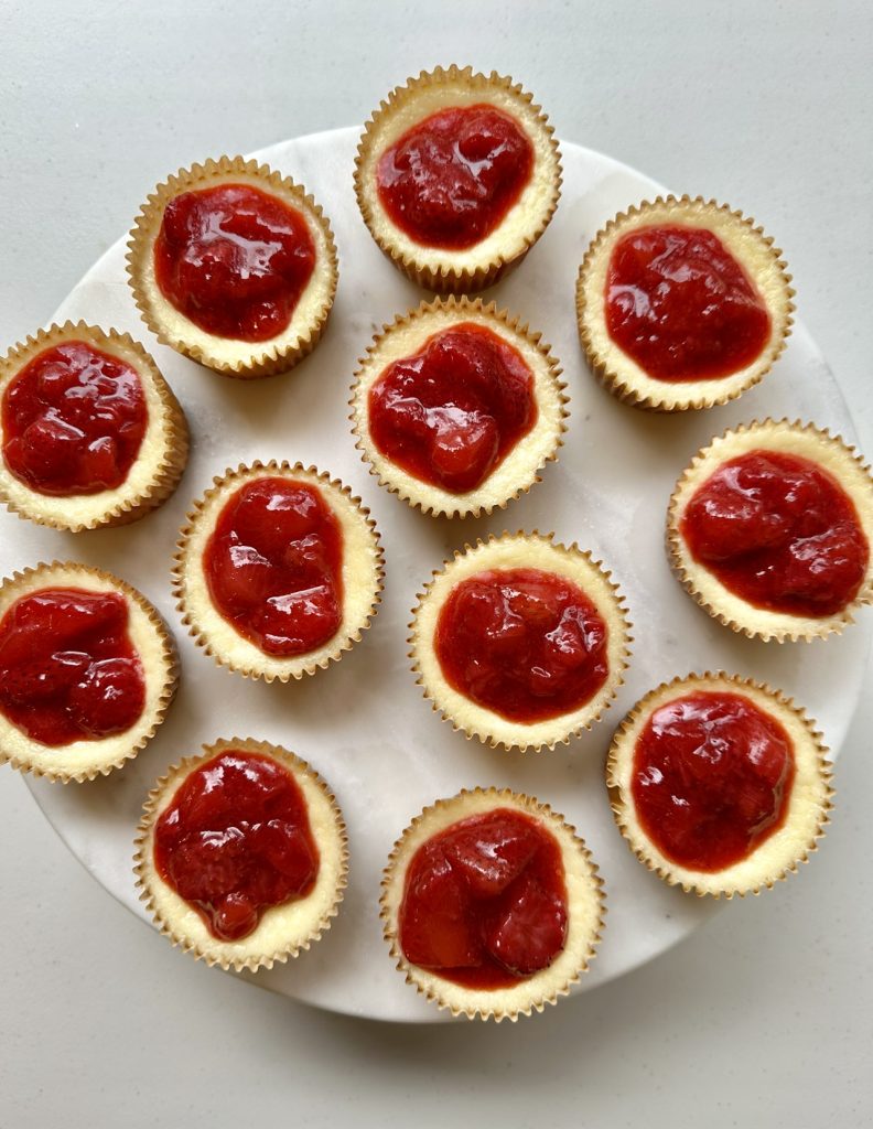 Mini strawberry cheesecakes are so much easier to make than traditional cheesecake, plus they're tasty too!