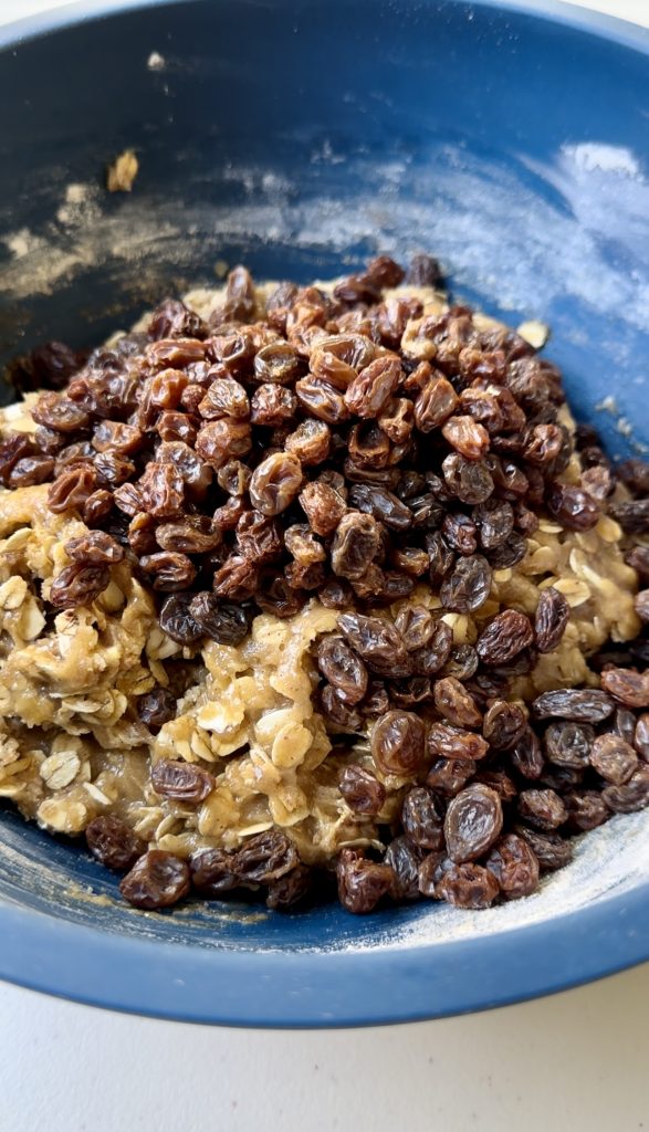 Soaking the raisins before adding them to the cookie dough makes them softer and more pleasant to eat!