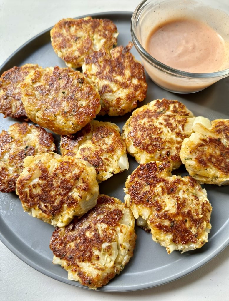 Cheesy cauliflower bites are crispy on the outside and soft on the inside. They're like healthier fritters!