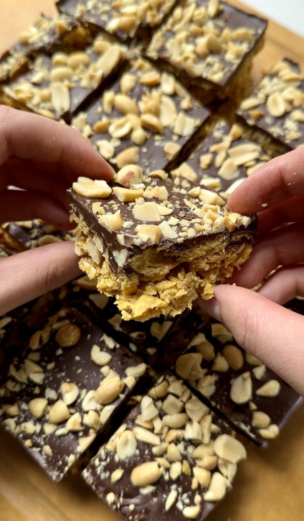 These bars need to chill for at least an hour in the fridge before slicing and enjoying! This sets both the chocolate and cornflake layers!