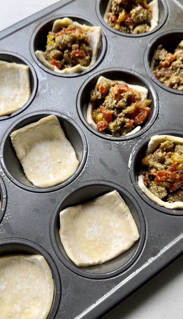 Be sure to grease your muffin tin before assembling the pastry cups. This will prevent them from sticking when they're baked.