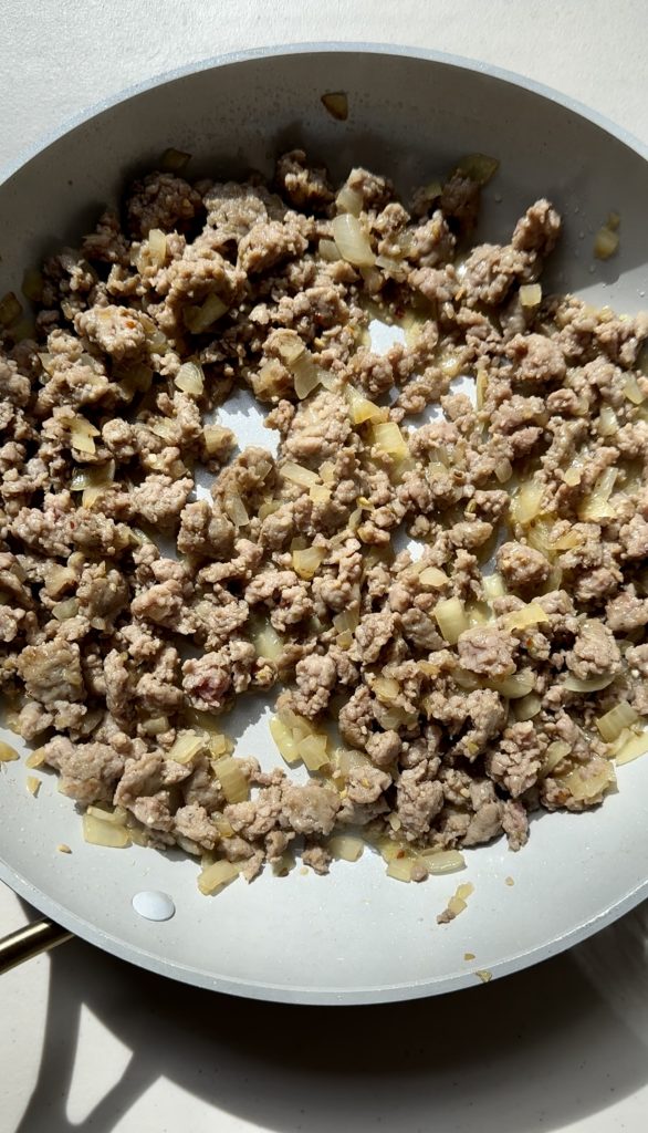Italian sausage can easily be substituted for ground beef in this recipe. No matter what you use, just make sure it's nicely browned with onion and garlic!