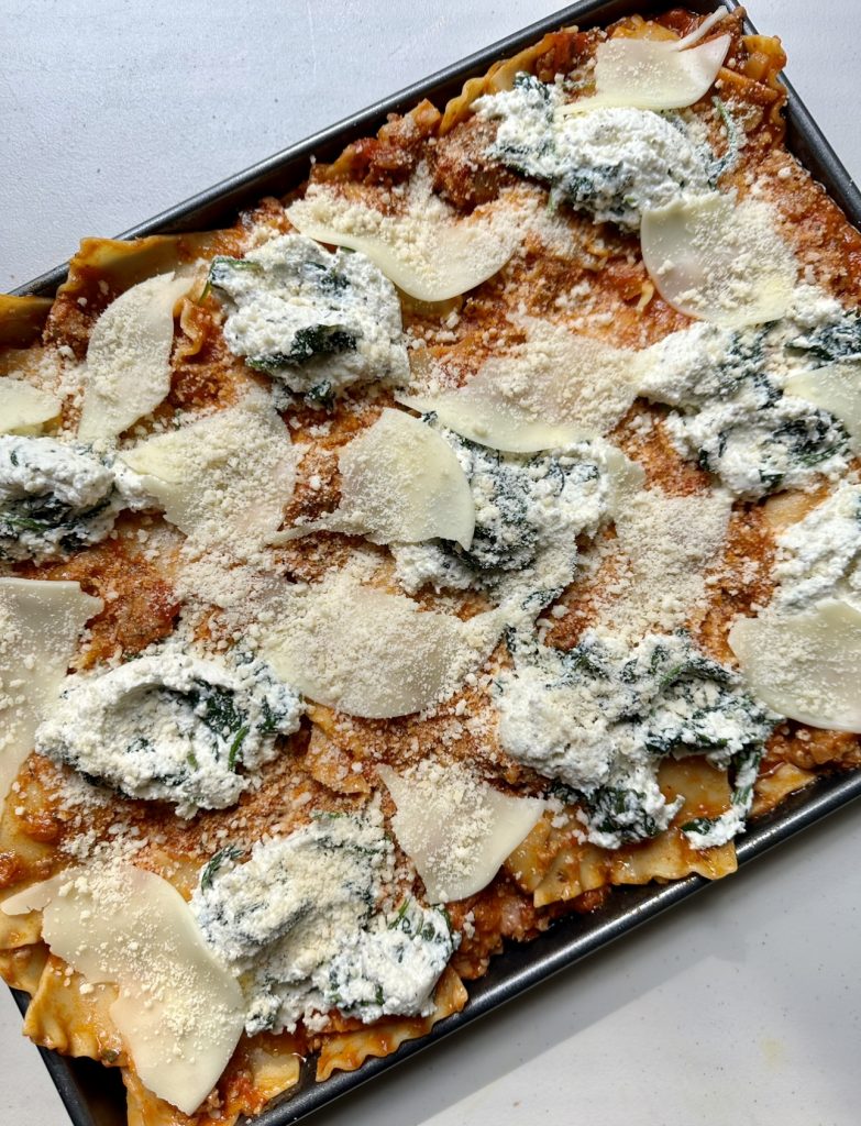 You'll want the surface of this lasagna to be lightly covered in cheese so that it becomes browned, crispy and golden in the oven.