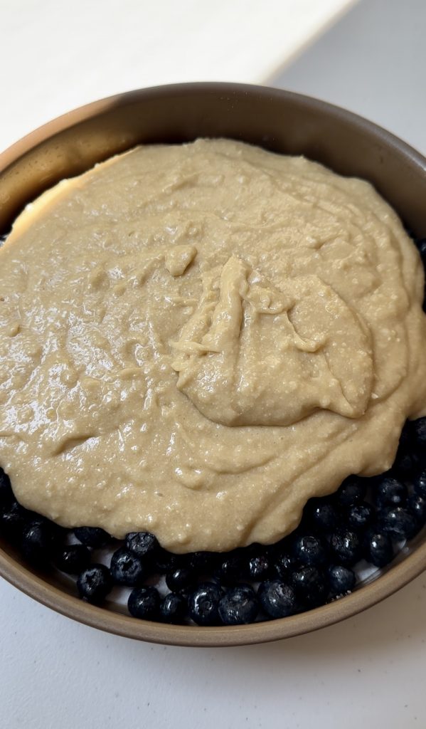 It's important to carefully pour the cake batter on top of the blueberries to prevent them from moving around too much!
