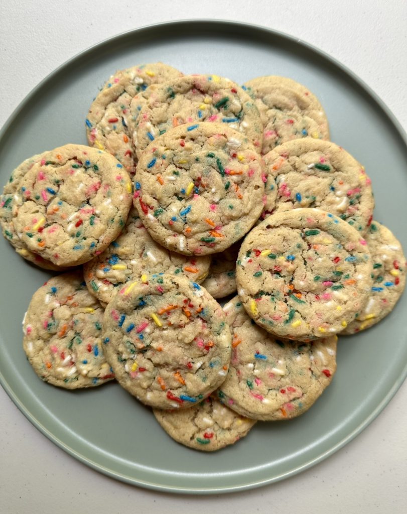 These sprinkle cookies are loaded with rainbow sprinkles, and bake up in just a few minutes with perfectly crisp edges and soft centers!