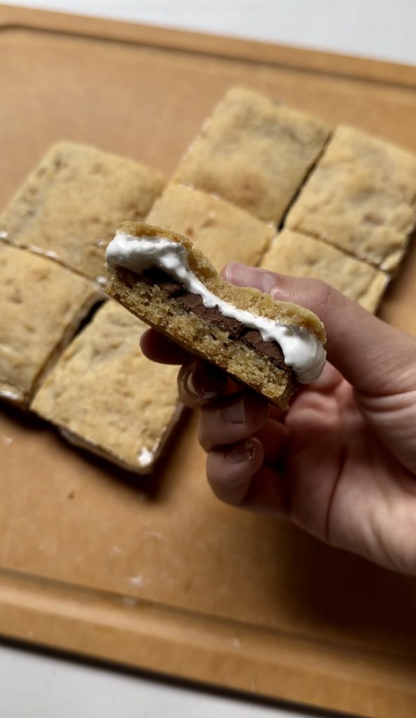 S'mores cookie bars are soft, gooey and completely addicting! It's an easy treat to make when it's too hot (or cold) outside to make s'mores over a real fire!